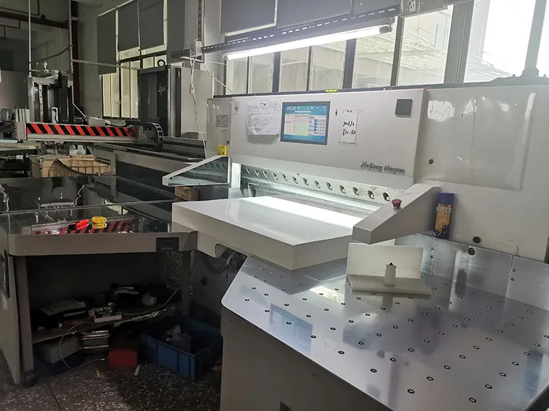 paper cutting equipment preparing custom ecommerce packaging sheets